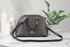 coach katy brown black dome satchel on marble table