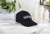 versace black baseball cap on marble table