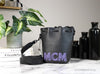 mcm mini black purple leather chain bucket bag on marble table
