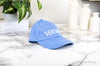 versace sky blue baseball cap on marble table