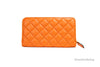 versace dark orange quilted clutch wallet back on white background