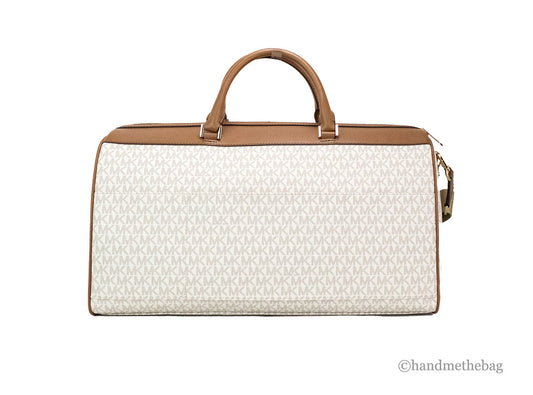 michael kors travel vanilla duffle back on white background