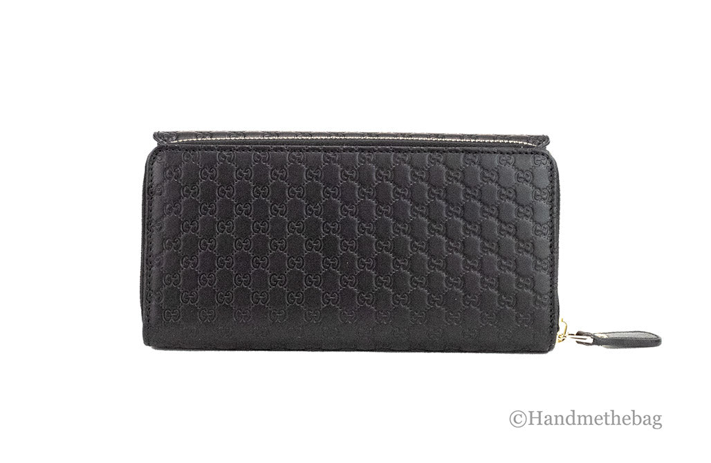 gucci microguccissima black clutch wallet back on white background