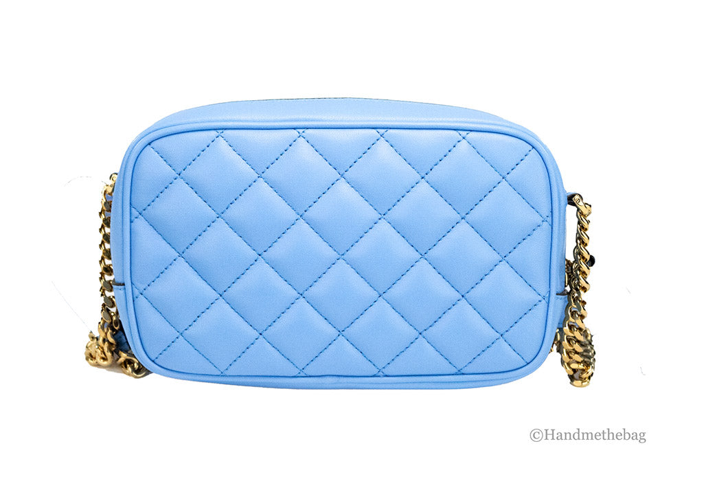 versace dv blue quilted crossbody back on white background
