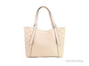 michael kors arlo large buff tomb tote back on white background