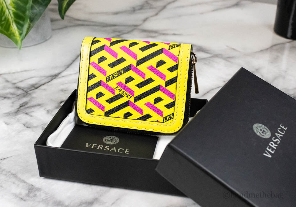 versace la greca yellow coin wallet in box on marble table