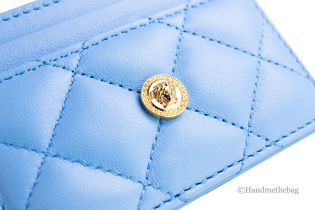 versace mini dv blue quilted card case detail on white background