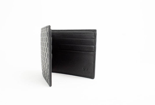 gucci microguccissima bifold wallet opened on white background