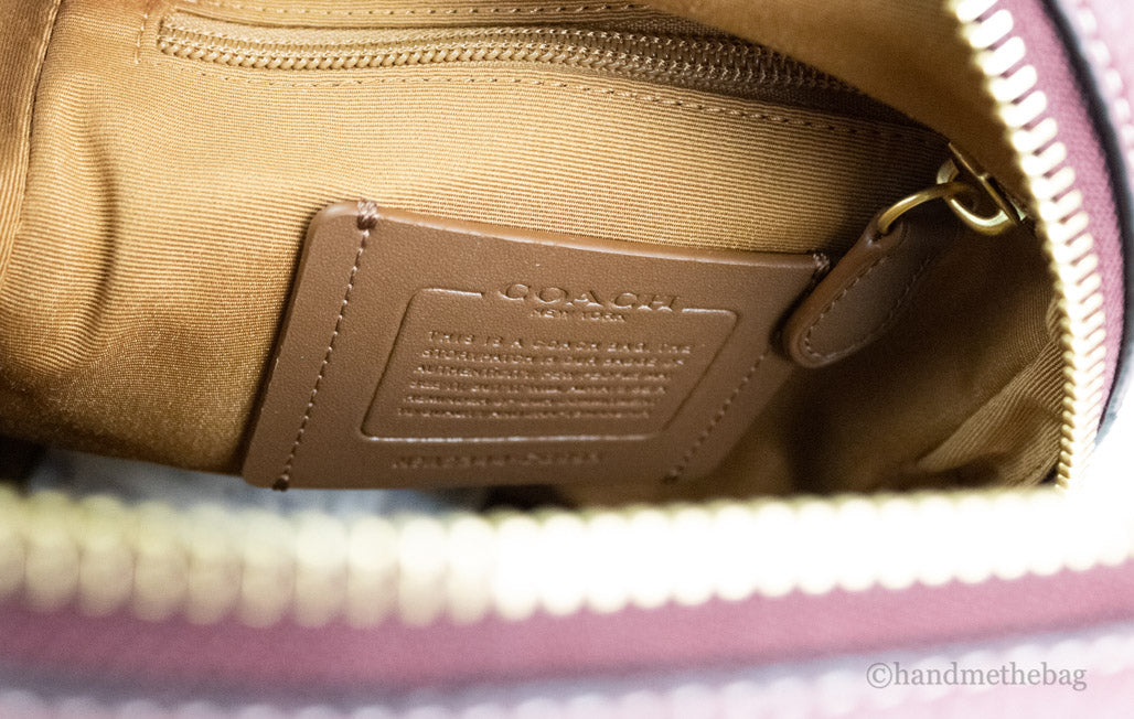 coach sullivan wine chambray pack inside on white background