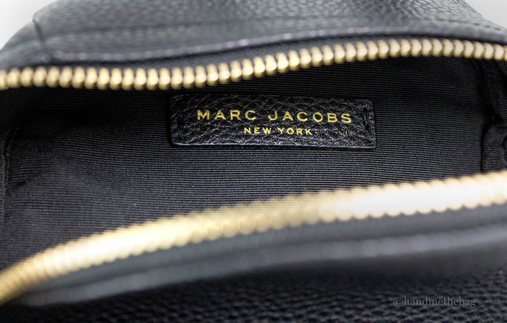 marc jacobs mini black backpack inside on white background