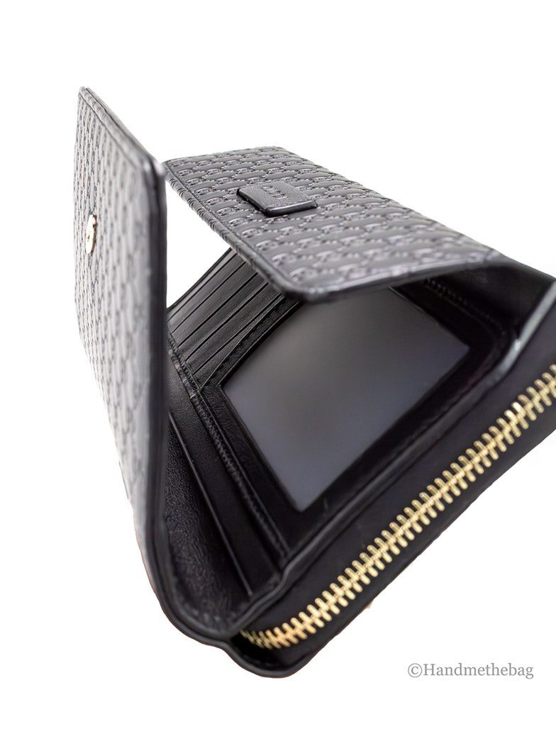 gucci microguccissima black clutch wallet opened on white background