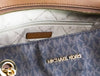michael kors jet set brown front zip tote inside on white background