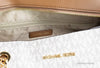 michael kors jet set vanilla front zip tote inside on white background