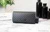 guccia microguccissima clutch wallet on marble table
