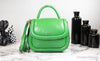kate spade puffy green bean crossbody on marble table