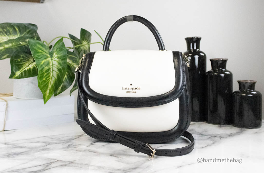 kate spade puffy black white crossbody on marble table