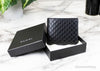 gucci microguccissima bifold wallet in box on marble table