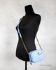 versace dv blue quilted crossbody on mannequin