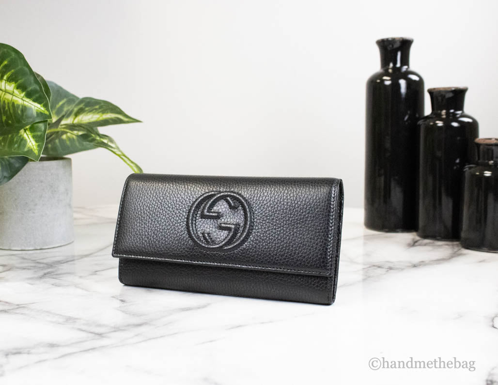 gucci cellarius snap clutch wallet on marble table