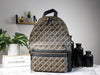 marc jacobs signet medium backpack on marble table