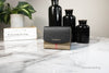 burberry luna black house check snap wallet on marble table
