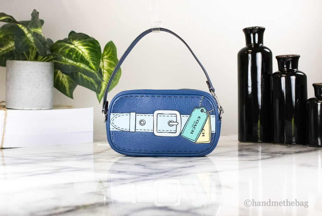 coach jamie trompe l'oeil print wristlet on marble table