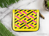 versace la greca yellow coin wallet flat on marble table