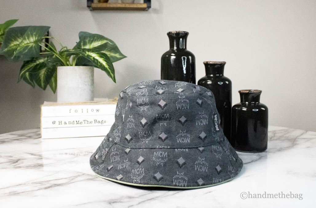 mcm visetos dark grey cotton blend bucket hat on marble table