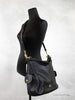 coach pennie black shoulder bag on mannequin