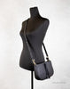 marc jacobs maverick black crossbody handbag on mannequin