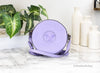 versace disco round lilac crossbody on marble table