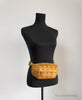 mcm visetos cognac belt bag on mannequin
