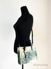 marc jacobs green splatter paint tote on mannequin