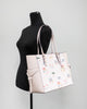 michael kors gilly travel print powder blush tote on mannequin
