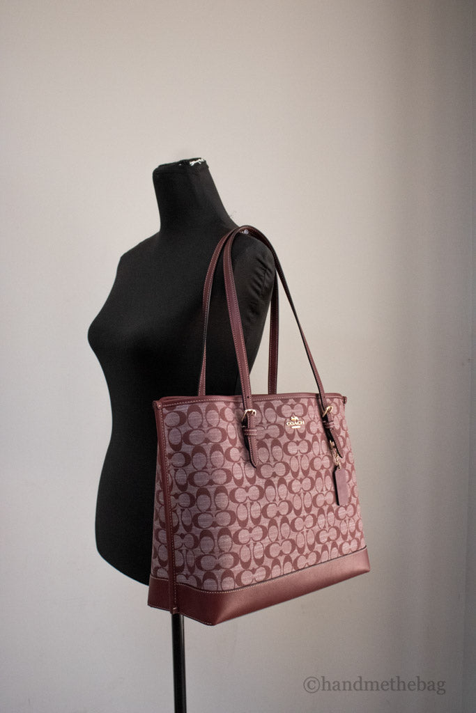 coach mollie wine canvas tote on mannequin