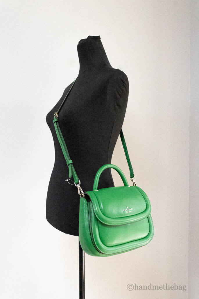 kate spade puffy green bean crossbody on mannequin