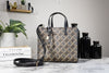 marc jacobs grind signet tote on marble table