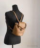 tory burch thea moose bucket backpack on mannequin