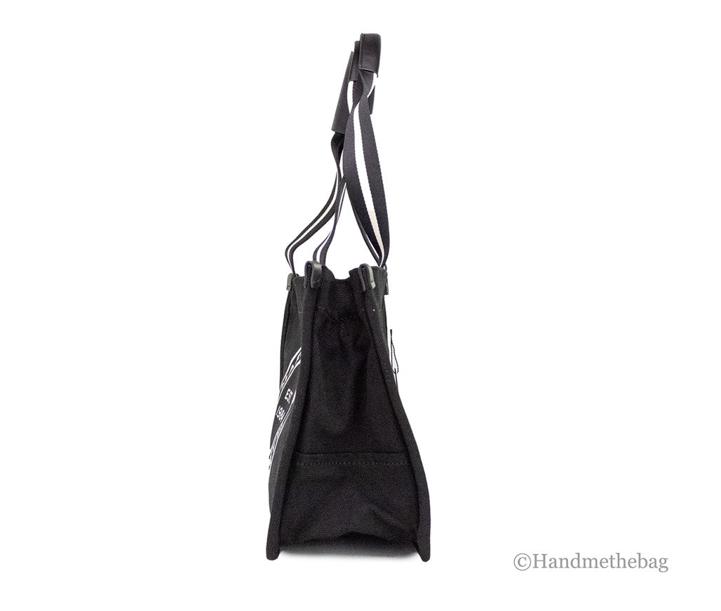 marc jacobs signet black canvas tote side on white background