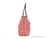 coach pink red houndstooth city tote side on white background