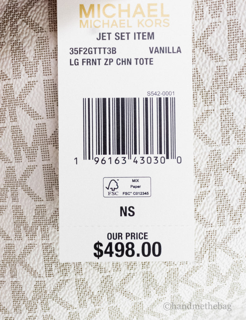 michael kors jet set vanilla front zip tote tag on white background