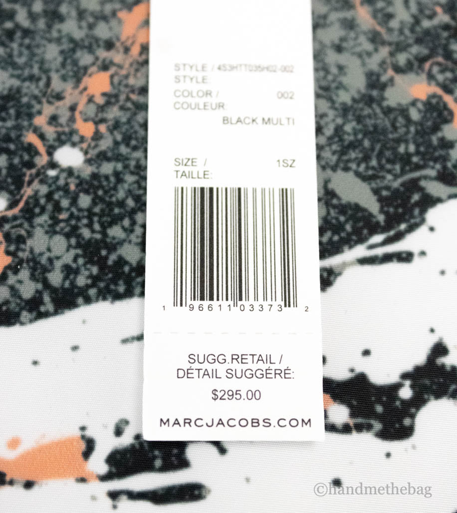 marc jacobs black splatter paint tote tag on white background