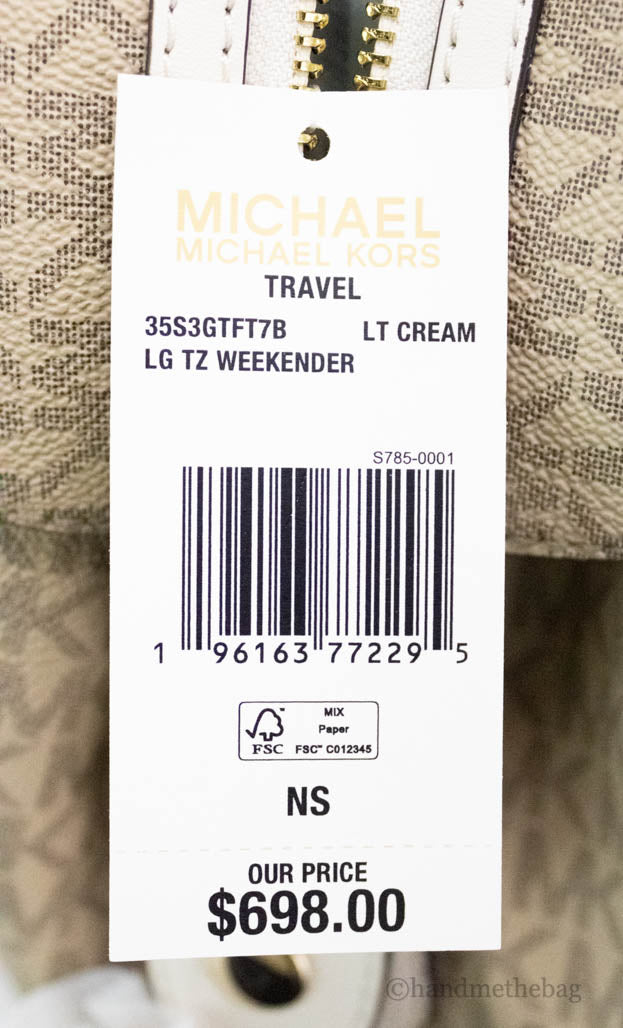 michael kors travel light cream patches duffle tag on white background