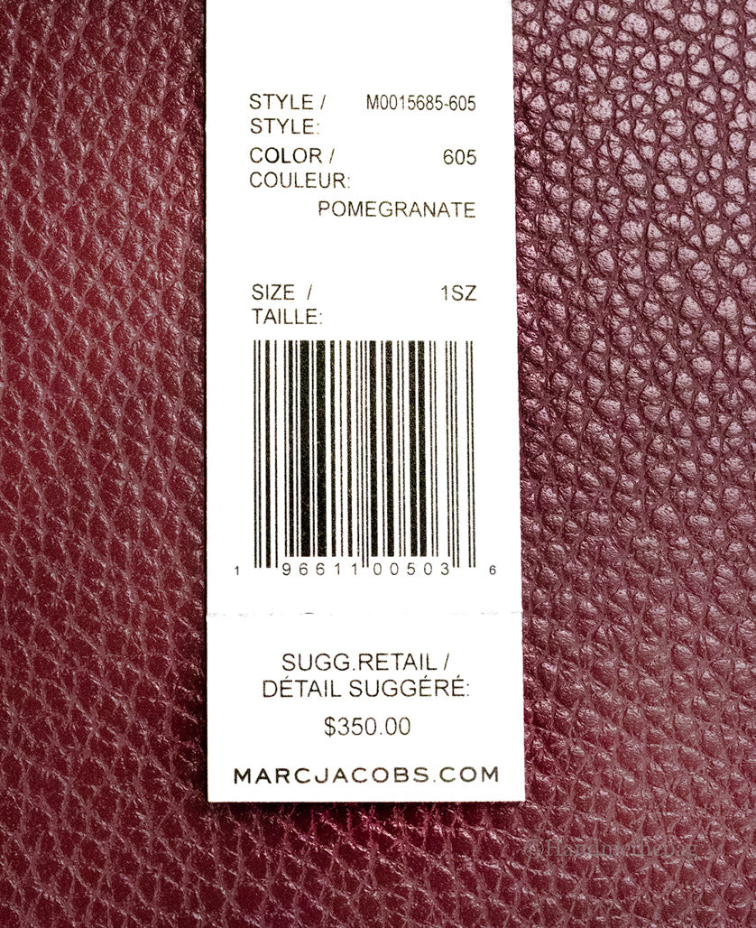 marc jacobs mini grind pomegranate tote tag on white background