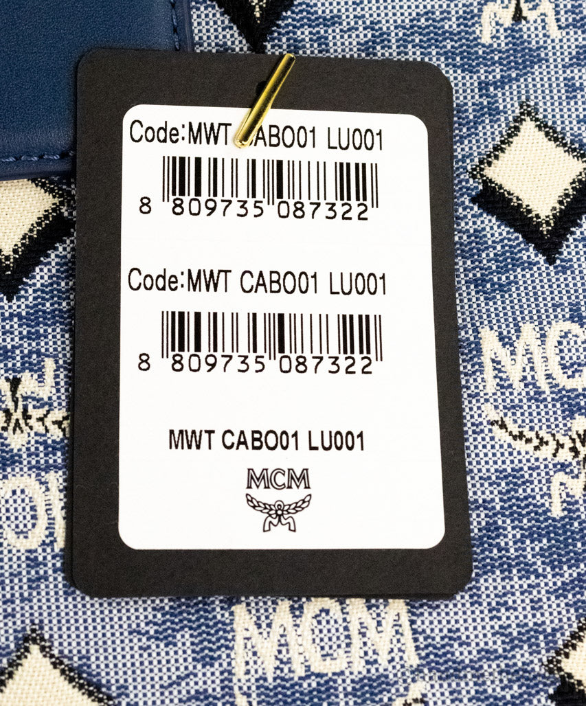mcm munchen xl blue denim tote tag on white background