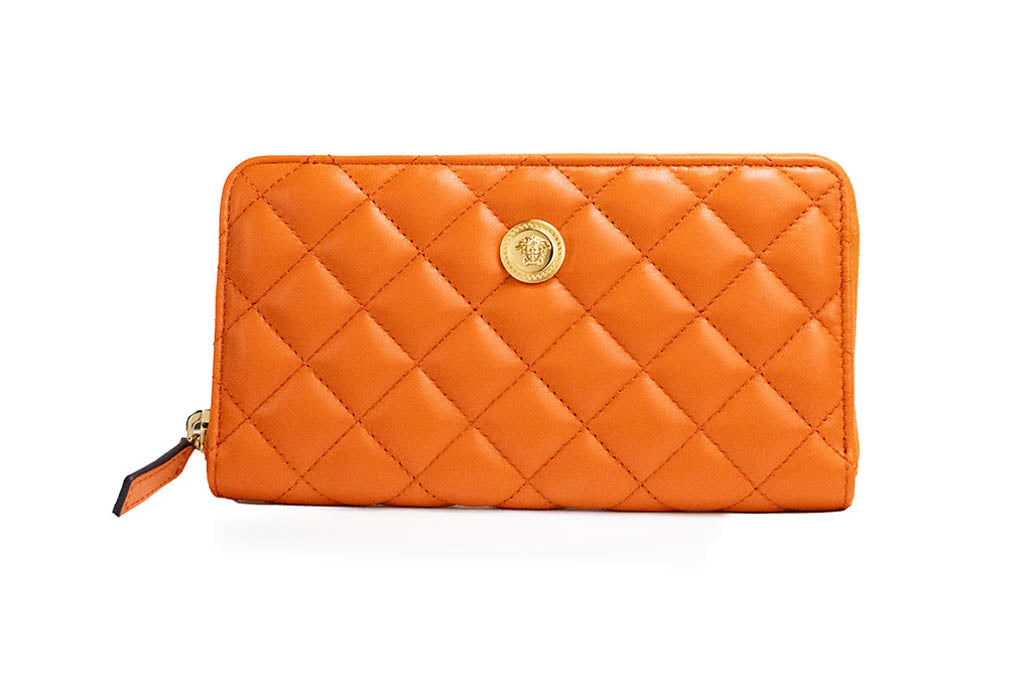 versace dark orange quilted clutch wallet on white background
