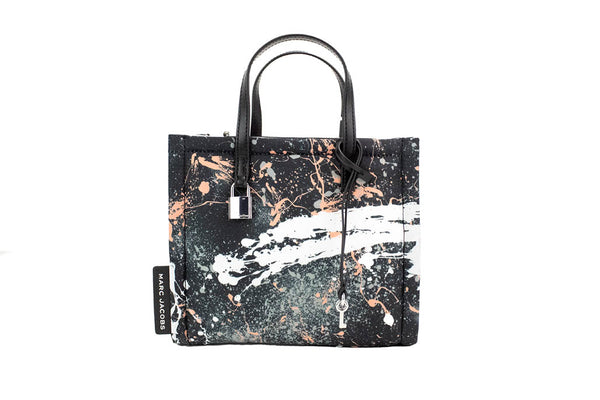 marc jacobs black splatter paint tote on white background