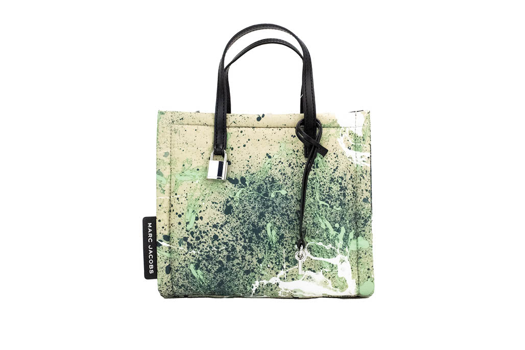 marc jacobs green splatter paint tote on white background