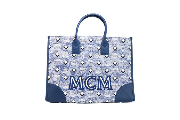mcm munchen xl blue denim tote on white background