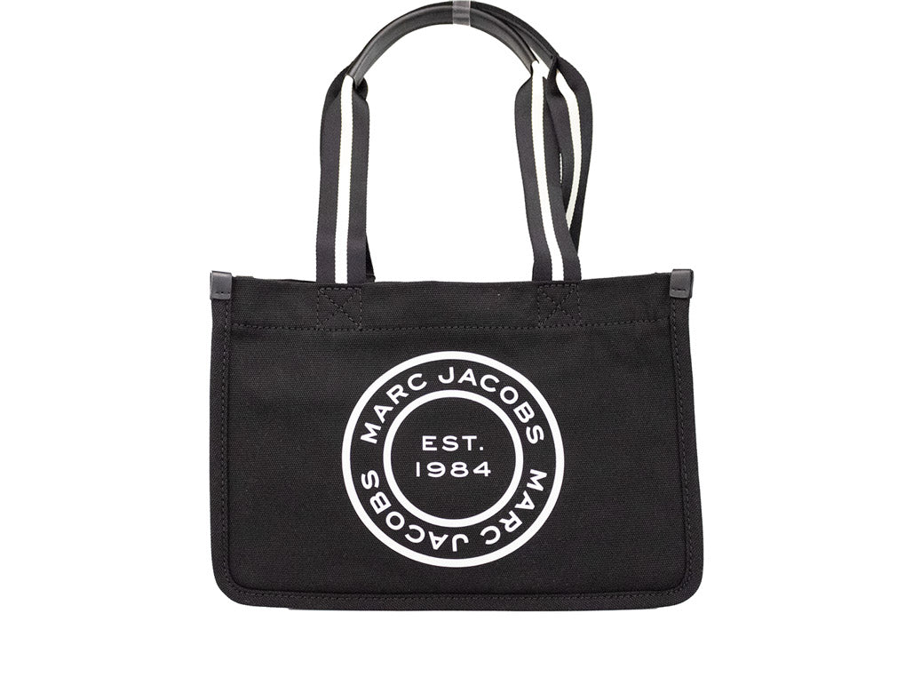 marc jacobs signet black canvas tote on white background